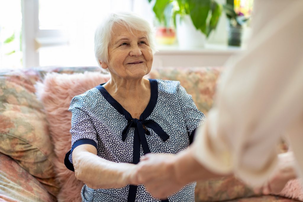 Care worker assisting senior woman