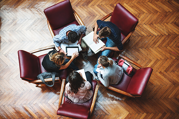 Group of five people in a meeting