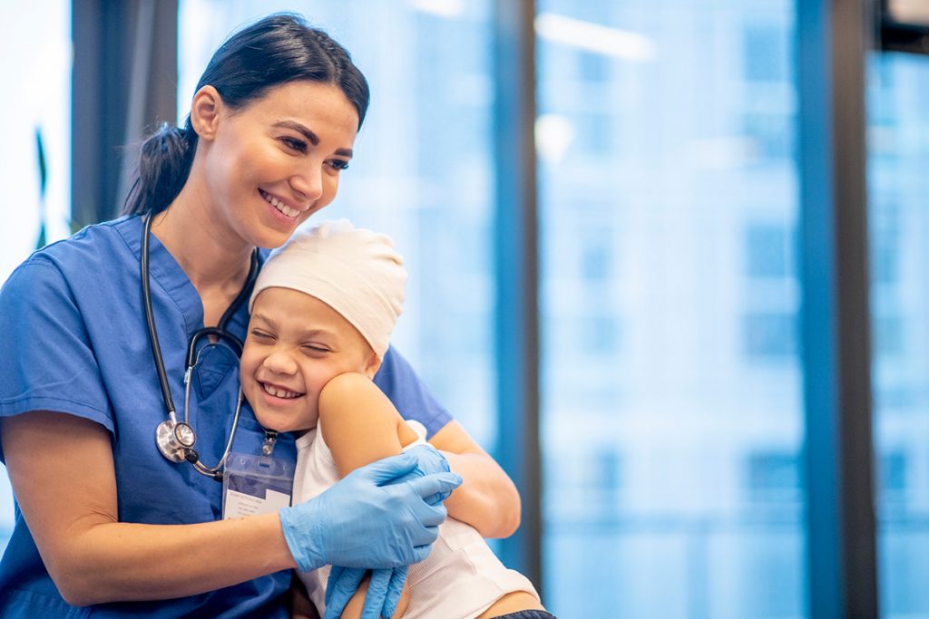Nurse Hugging Young Cancer Patient