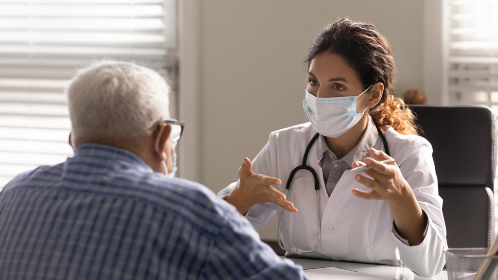 Doctor in discussion with senior patient