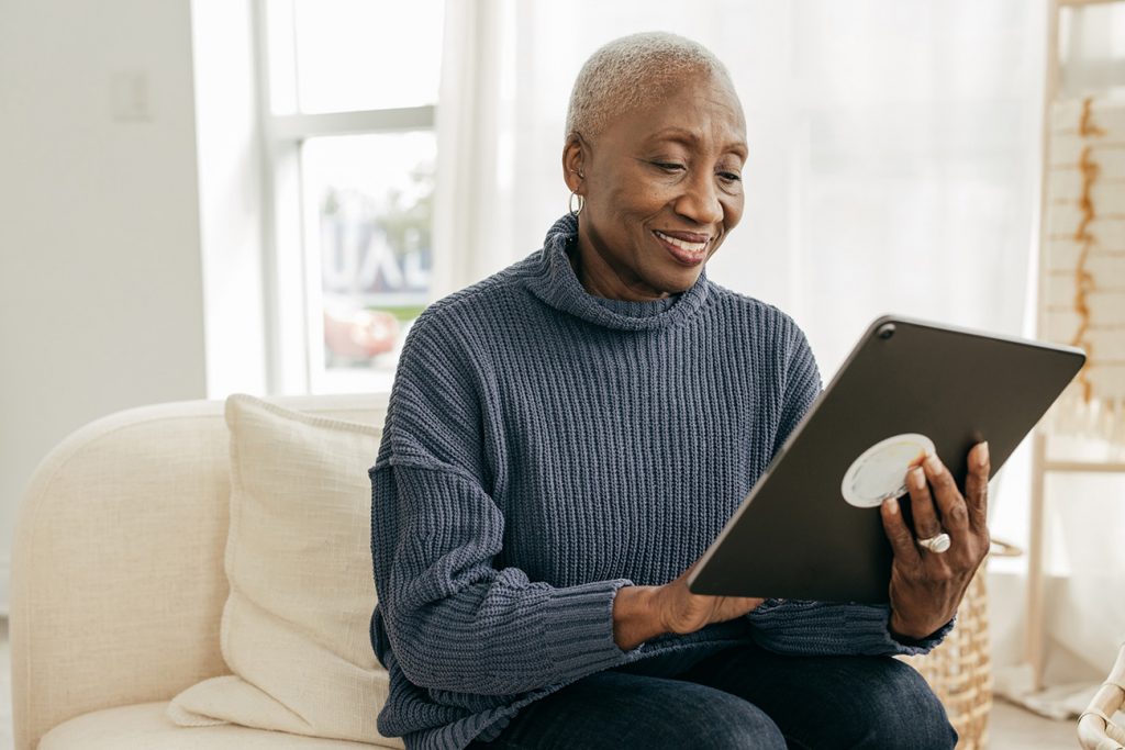 Senior woman speaking to doctor on her tablet computer